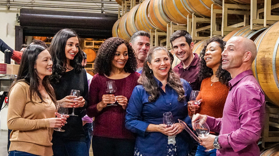 Group of diverse people on wine tour