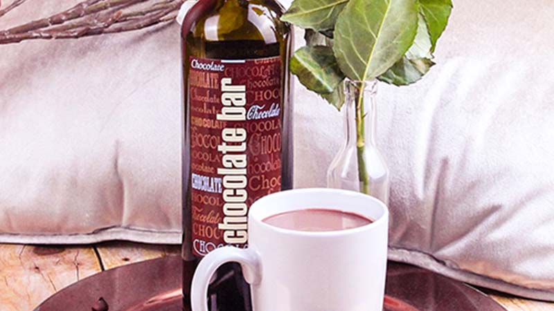 Bottle of Chocolate Bar port with mug of Hot Chocolate